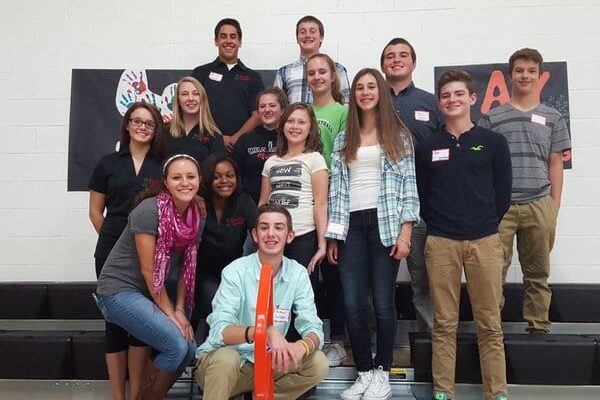 A diverse group of students celebrate Say Something in their school gymnasium. These students from Chardon High School were among the first in Ohio to hold Say Something, back when the program launched in 2015.