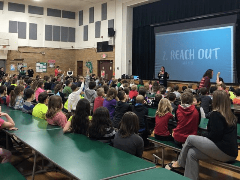 Students in auditorium getting trained on Sandy Hook Promises's programs