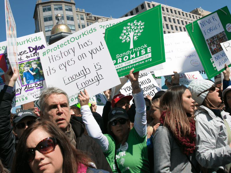 Sandy Hook Promise's supporters holding signs at a gun violence prevention rally in DC.